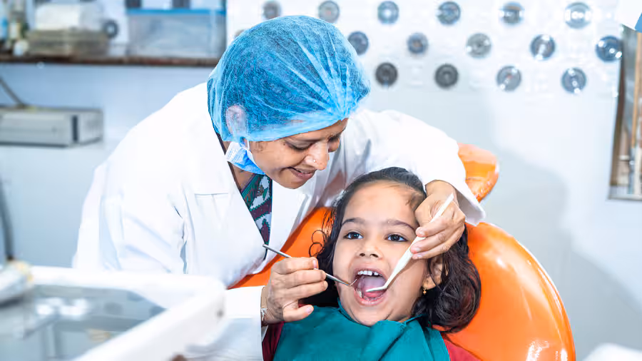 A Pediatric doctor gently checking on a child.