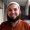 A Picture of Pakistani man smiling with white teeth.